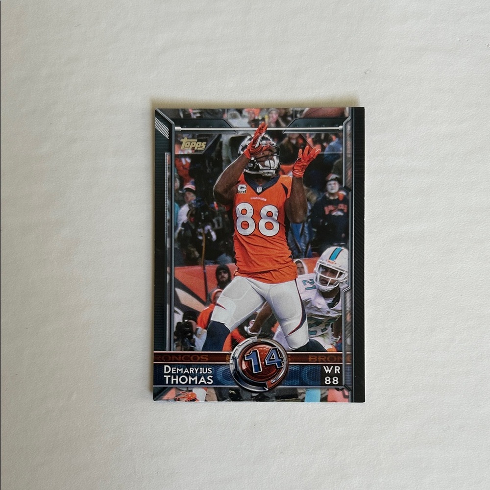 Topps Football Card with Orange and Black Accents
